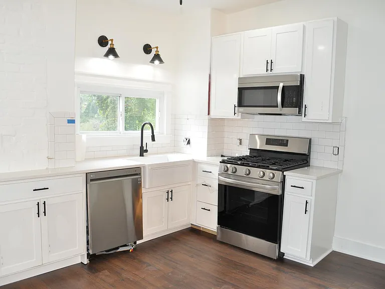 Farmhouse sink and with new stainless steel LG appliances.