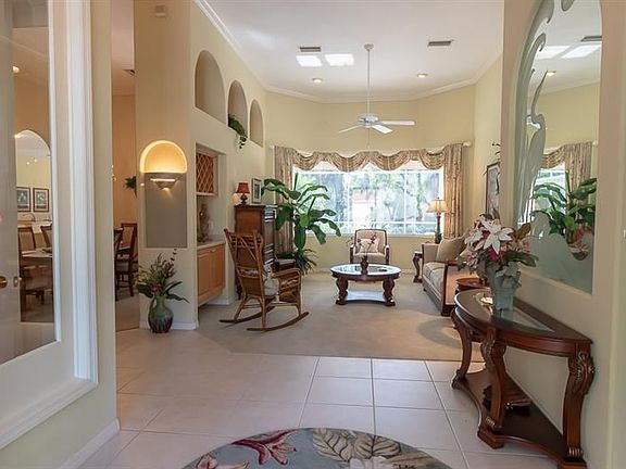 Foyer opens to formal living room/dining and den