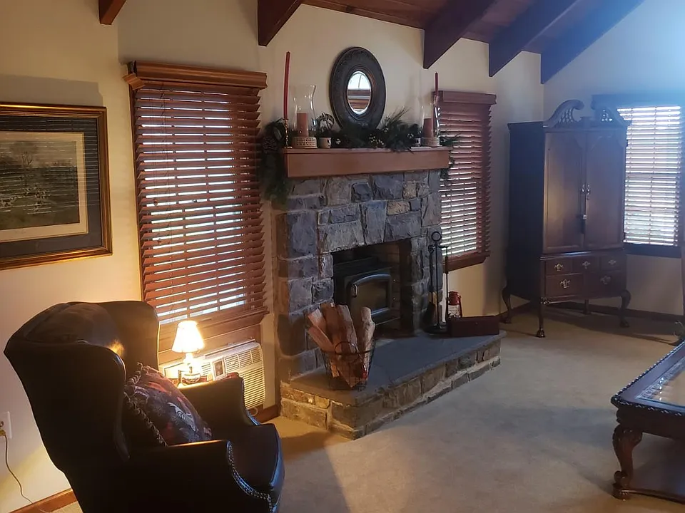 Family room -- fire place, wood stove, cathedral ceiling, open beams