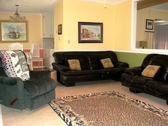 Bright beachy colors. Great room opens to living room/game room has pool table