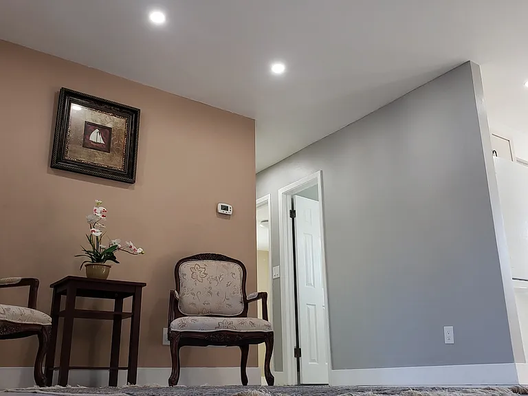 View of Living Area and Section of Hallway and Kitchen.