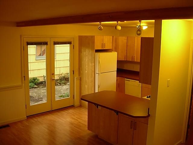Open kitchen with doors to yard.