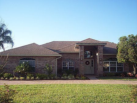 Elevation-brick paver semi-circular driveway