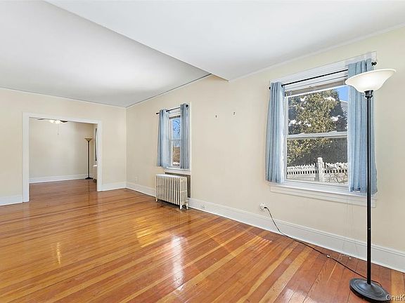 VIEW OF LIVING ROOM INTO THE DINING ROOM