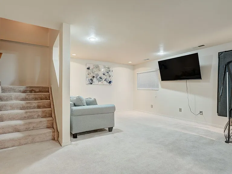 Basement features a pull out couch, TV and Ping Pong table!