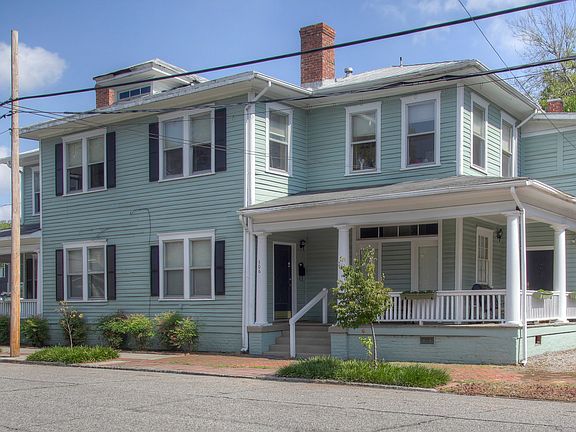 Upper half of house. Porch and door to far right.