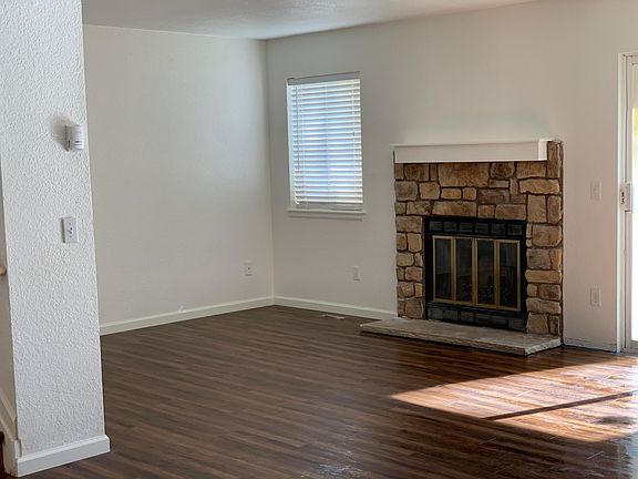 Living room with wood burning fireplace