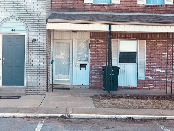 Panned out view of the front door of #45.  You can see it is tucked nicely between other townhomes.  You have a lot of insulation from the north and the south.  Plus, as you can see, a covered patio is an asset not available to all.