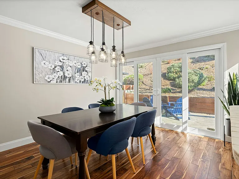 Dining room with sliding doors to the backyard for easy hosting, bringing the indoor and outdoor entertaining spaces together.