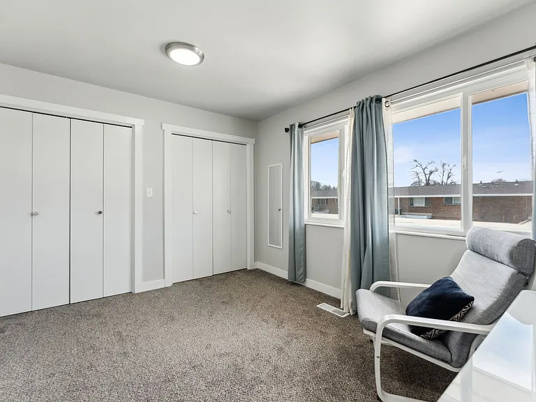 Rear bedroom/office has plenty of storage.