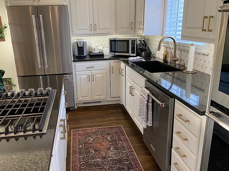 White cabinets with gold fixtures and hardware