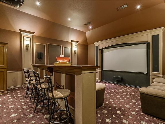You'll love relaxing with a great movie in the private media room boasting a screen, projector & bar.
