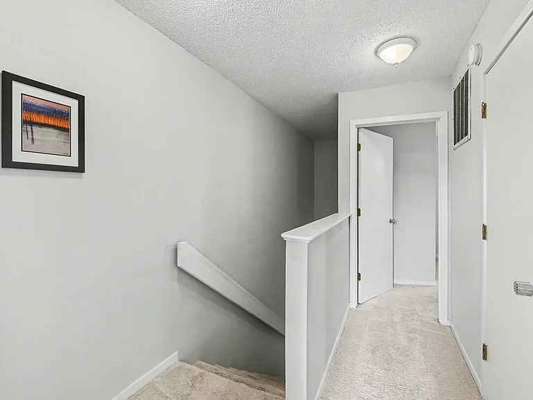 Upstairs hallway leading to the 2 additional bedrooms
