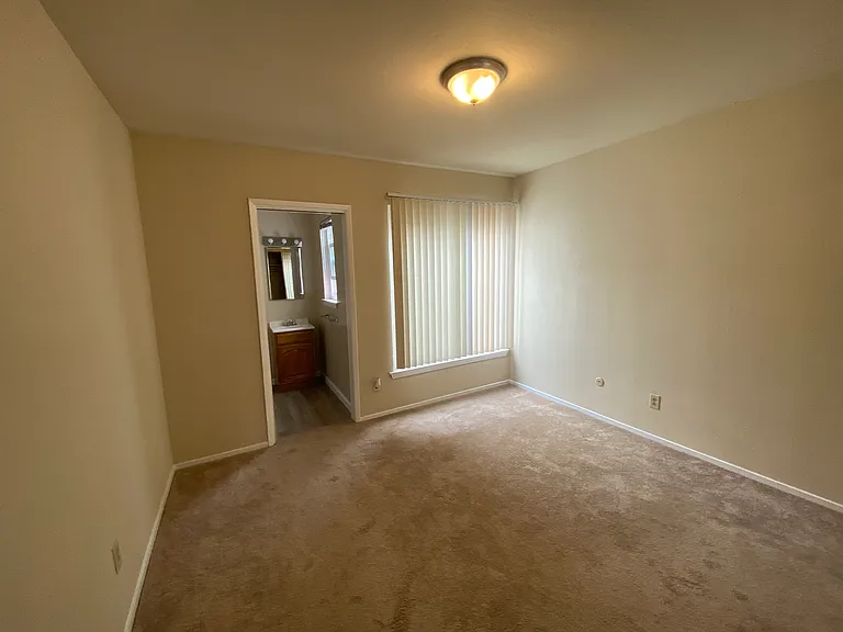 Master bedroom with half bath