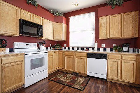 Kitchen has built-in microwave and tiled counters