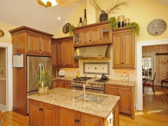 Granite Countertops, cathedral ceilings, Chef's stove and hardwood floors.