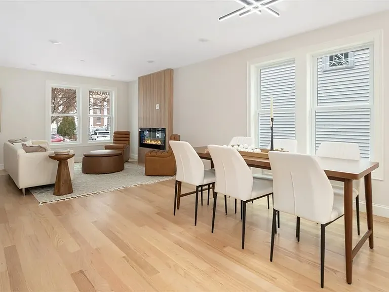 Open and airy: Looking back toward the living room, you can see how the generous floor plan and dual windows create a bright, expansive feel.