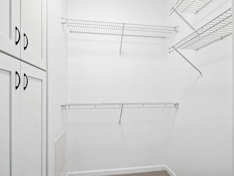 Guest walk-in closet and storage spacious storage cabinet. Freshly painted and new LED light. New carpet.