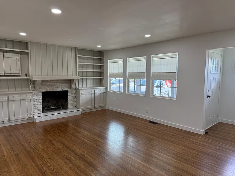 Spacious living room with fireplace, creating the perfect setting for gathering with family and friends