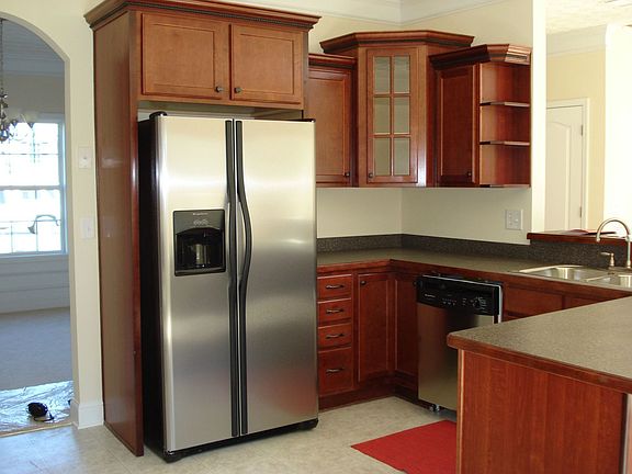 Chef's kitchen with stainless steel appliances.