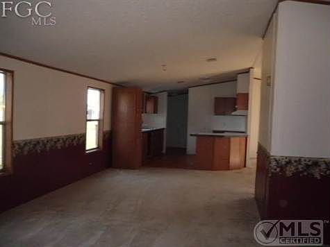 Family room with view of kitchen.