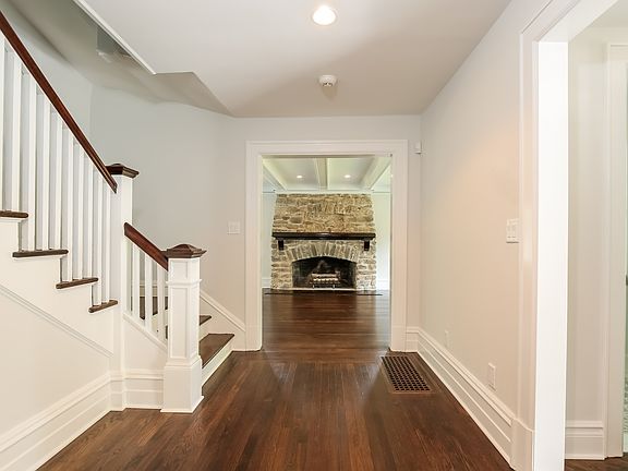 Entrance foyer with gorgeous refurbished original hardwood floors
