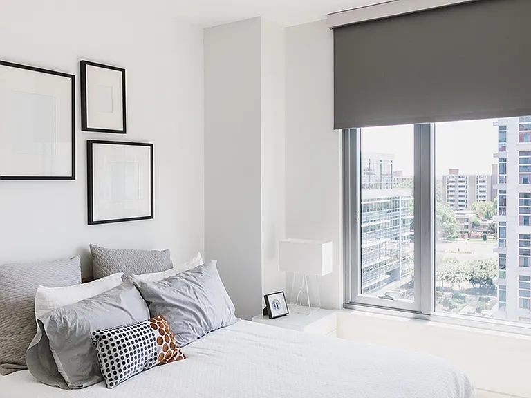 Oversized windows featuring roller shades