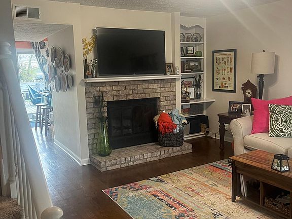 Living room, includes wood-burning fireplace. (16x13)