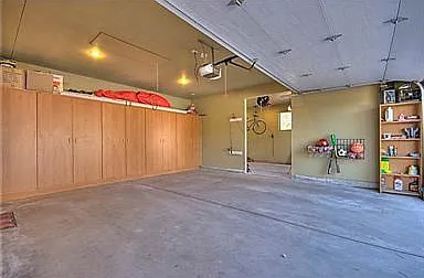 Large 3 Car Garage - 3rd car is beyond outer wall through the wall for storage, workshop or other - Large Bank of Finished Cabinets