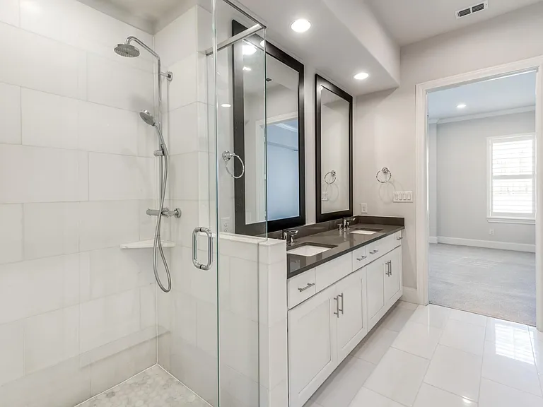 Actual marble flooring and shower tiles, not the marble-looking porcelain tiles you see elsewhere.