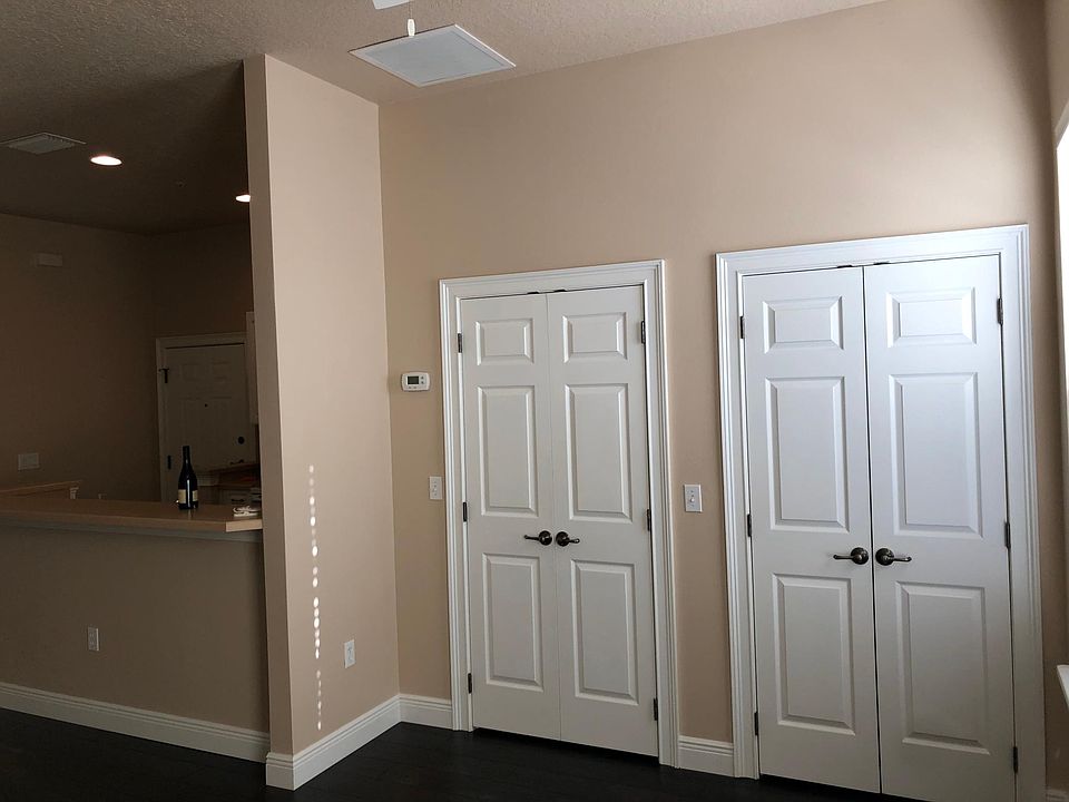 Large walk in closet and storage closet.