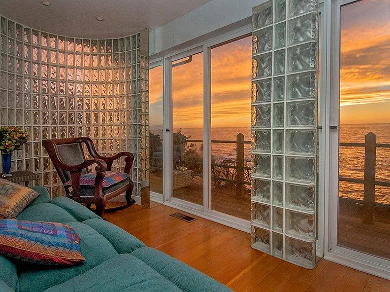 sunset view from beyond dining room, couch on left.