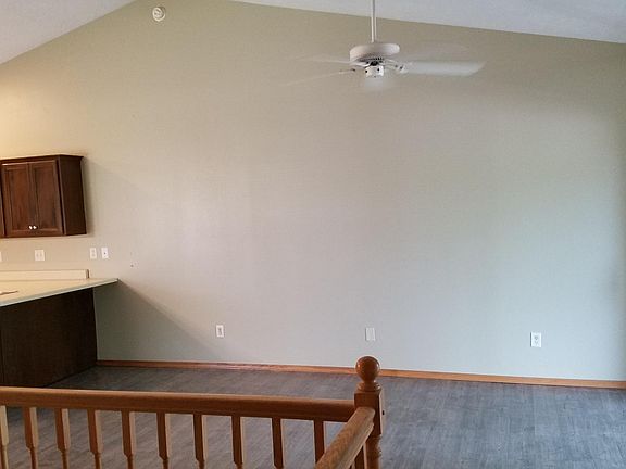 Open floor plan with sliding glass door to covered deck.