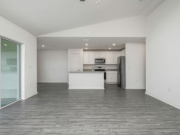 The family has a sliding glass door that leads to the backyard