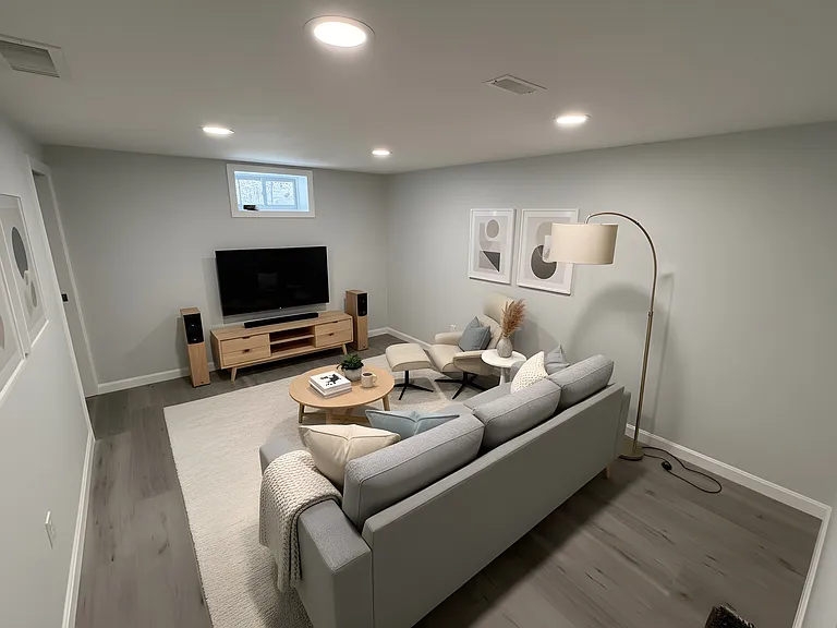 Spacious lower level bonus room set up as a movie room