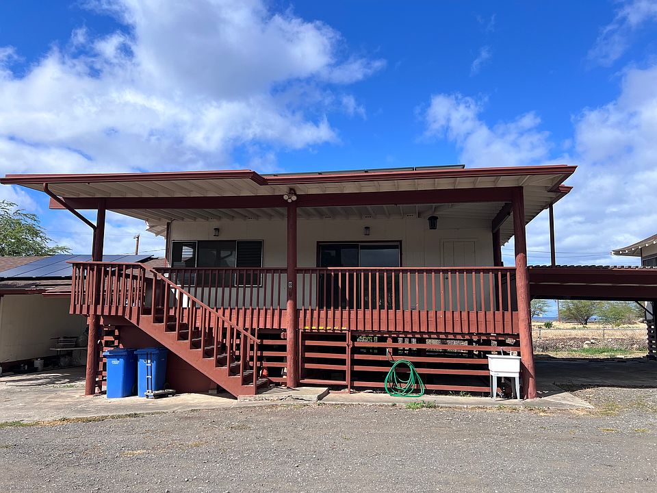 Front of house. Shared carport on right.
