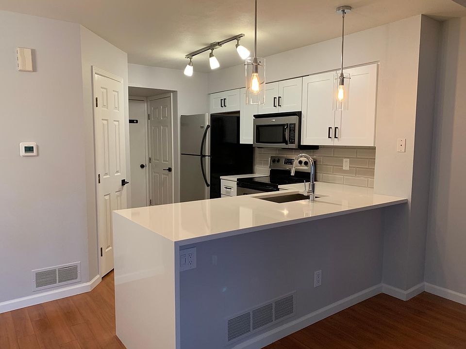 Kitchen with waterfall Quartz counters.