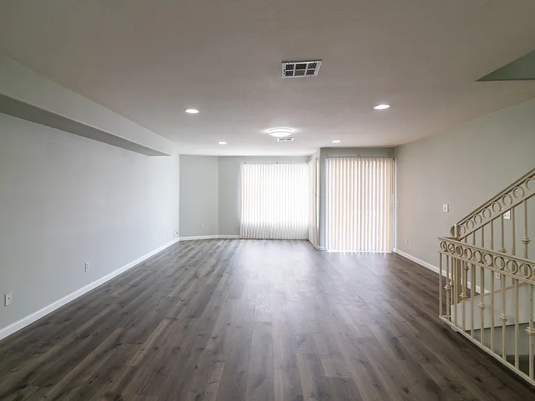 spacious living area with balcony (view)