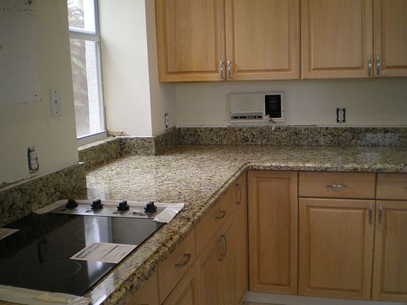 Other view of kitchen showing new cooktop. 
