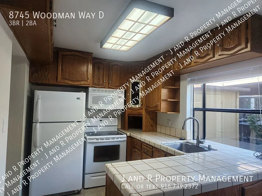 8745 Woodman Way — Photo 3