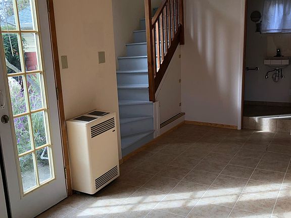 New tiling throughout lower level and bathroom. New tiled shower.