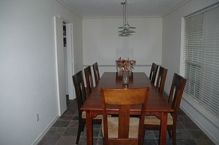 Dramatic dining room accomodates large parties or intimate gatherings. 
