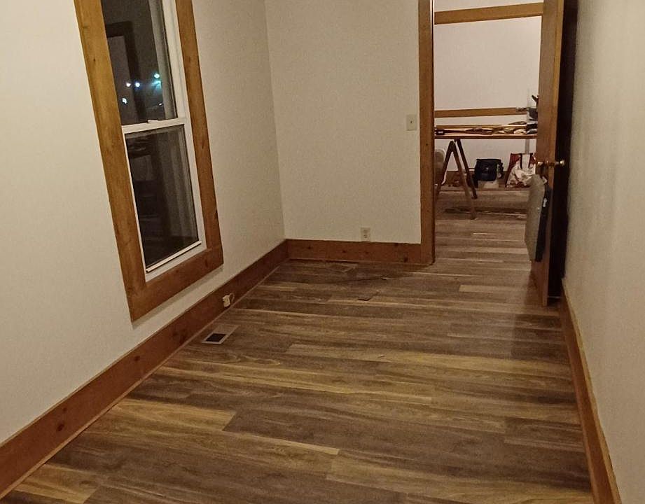 Bedroom view from closet, looking into living room.