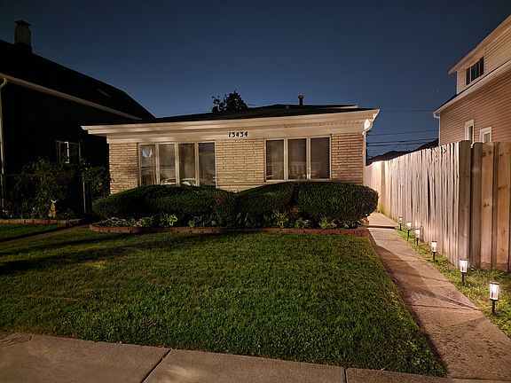 Night Curb Appeal: So much charm and curb appeal. Manicured lawn and a clean walkway.