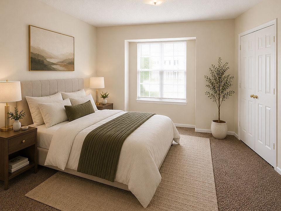 Spacious bedroom with a closet, soft natural light, and room for a full bedroom set.