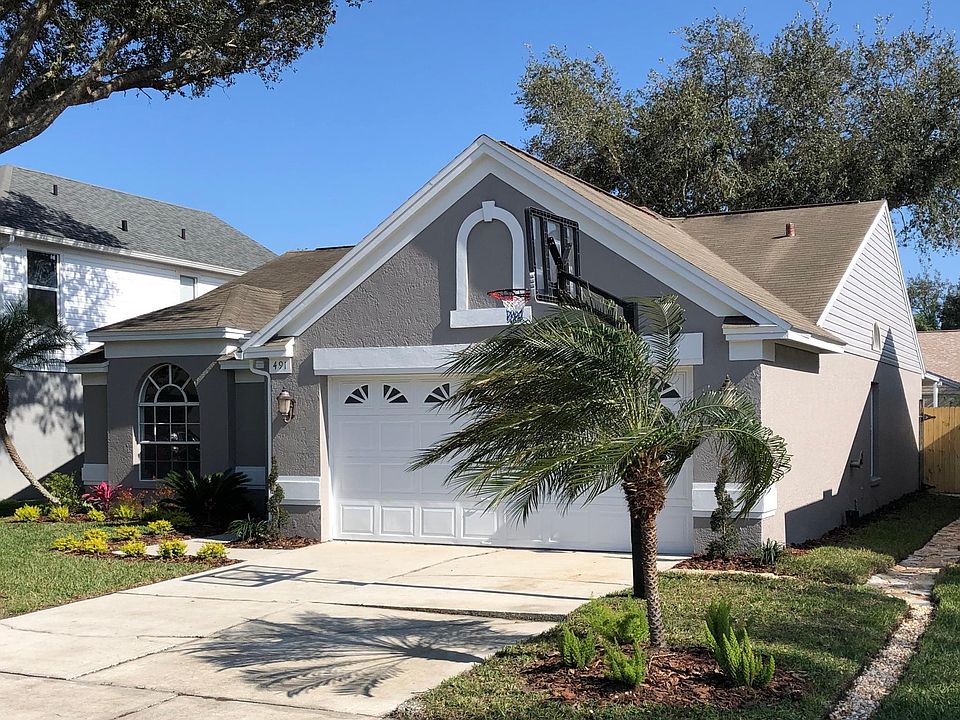 Street view with all new landscaping. Don't worry about lawn maintenance because that is included in the rent!