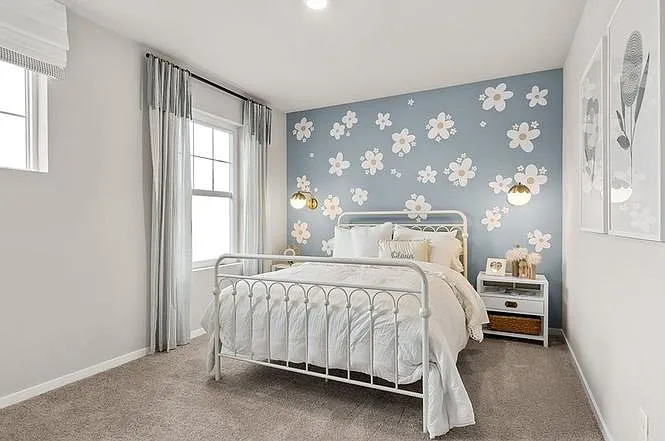 3rd Bedroom with large windows and front yard views.