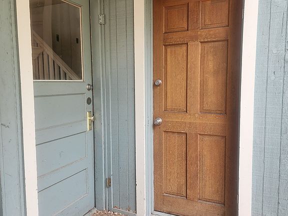 Main entrance on the left. Wood door on right is it's own private entrance to bedroom 2 of 2 that is downstairs / on main level.