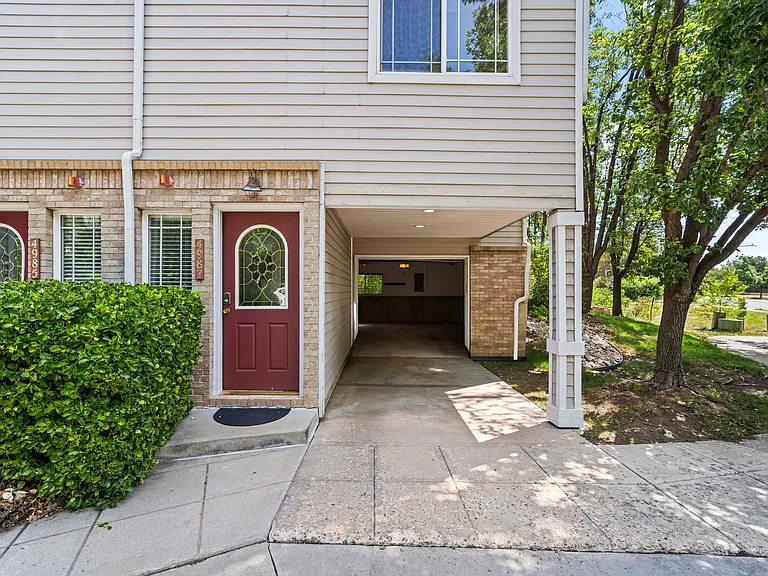 Front door, carport, garage. walking/bike path