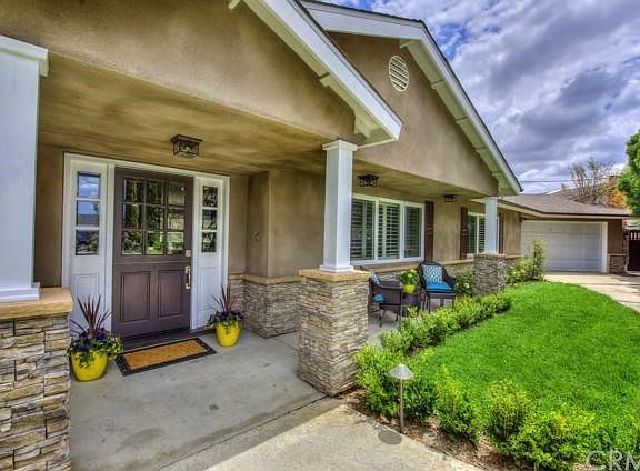 Inviting Curb Appeal with Dutch Door and Front Porch